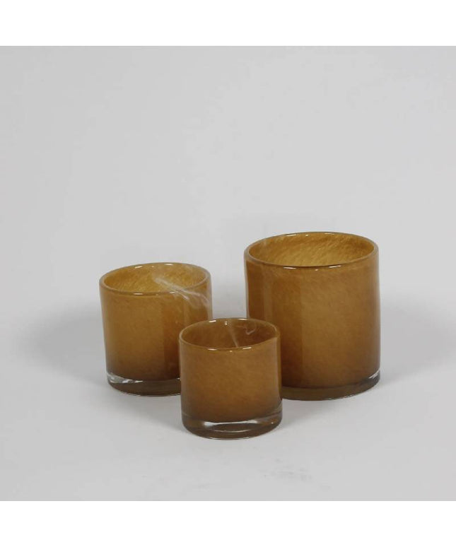 Fyrfadsstage i karamelfarvet glas