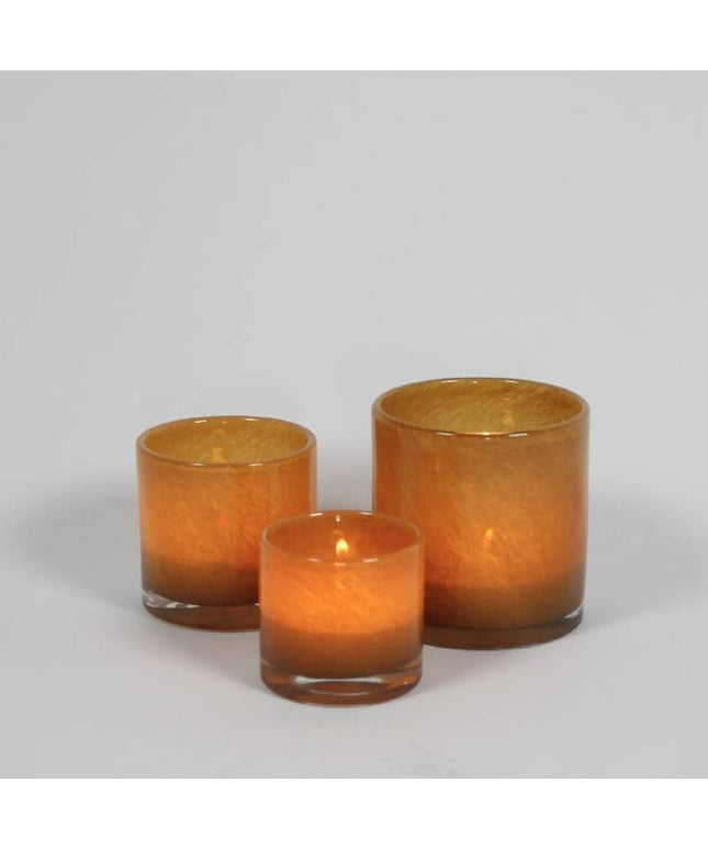 Fyrfadsstage i karamelfarvet glas